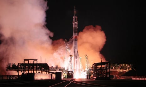 A Soyuz TMA-15M spacecraft carrying supplies for the international space station blasts off from the launch pad at the Baikonur cosmodrome