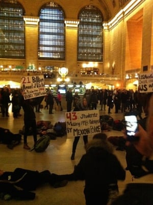 Protest in Grand Central Terminal NY
As part of the global protests that took place Nov 20th, a group of people congregated and made a “flash mob” like event at Grand Central Terminal in NY. They were protesting against the Mexican government and their lack of answers of the kidnapped 43 students of Ayotzinapa and demanding answers to the widespread corruption system in Mexico. This was part of several actions that took place the same day in NY: in front of the Mexican Consulate, of the UN headquarters and Times Square