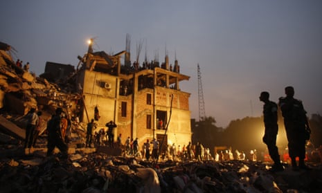 Rescue workers look for trapped garment workers in the collapsed Rana Plaza building in Savar, Bangladesh, in April 2013.
