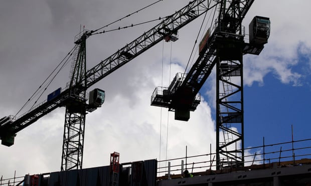 Cranes above a construction site in Manchester. The OECD says growth will coptinue in the UK through 2016.
