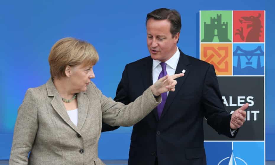 German Chancellor Angela Merkel gestures as she meets with British Prime Minister David Cameron at the NATO Summit on September 4, 2014 in Newport, Wales.