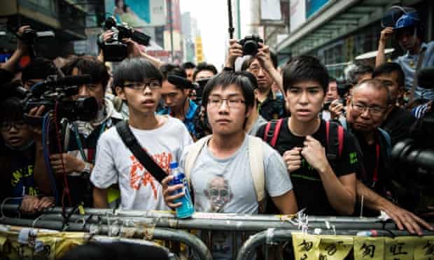 Joshua Wong, Rafael Wong, and Lester Shum, all leaders of the pro-democracy "Occupy" movement await clearance of the protest camp