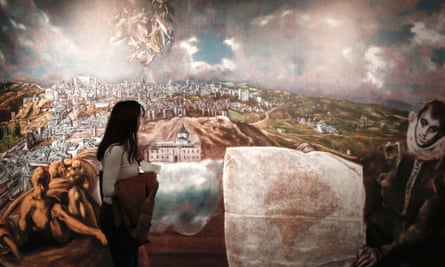 A visitor looks at a digital reproduction of El Greco's View and Plan of Toledo with map, at the Benaki museum in Athens.