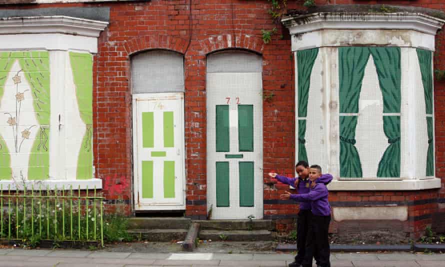 School children outside a boarded up house in Toxteth, Liverpool.
