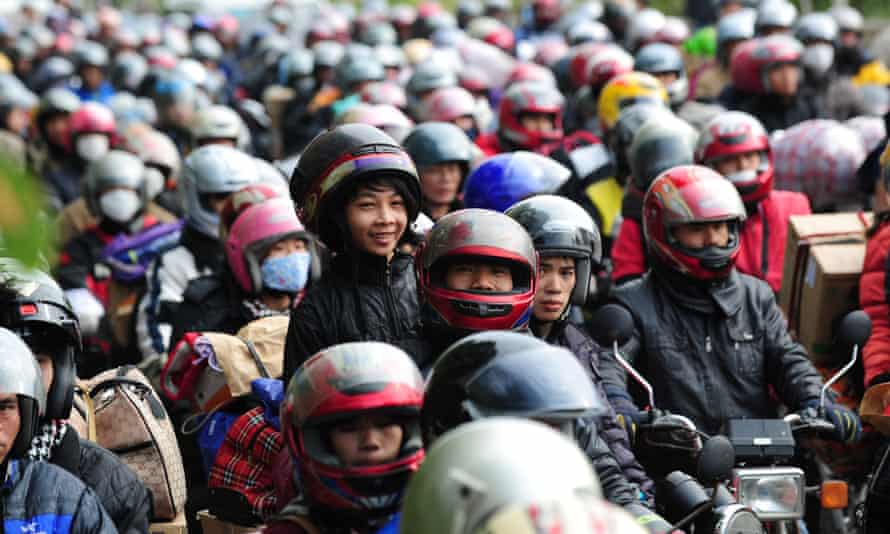 Migrant workers drive motorcycles returning to their remote Guangxi, Guizhou and Sichuan provinces hometown.