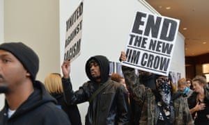 Black Friday protests highlight police violence as well as poor wages | US news | The Guardian