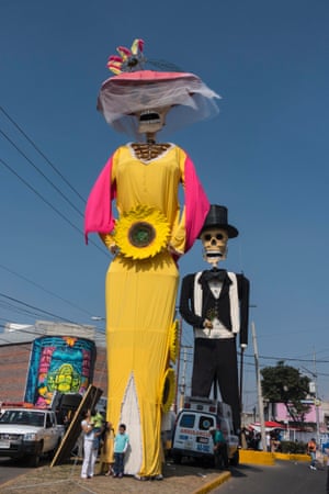 Large dressed skeletons greet visitors when arriving in San Andres de Mixquic