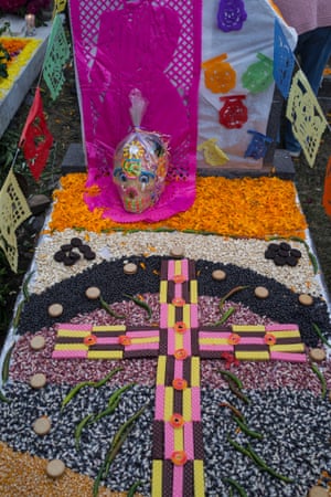 A child’s grave traditionally decorated in cookies and candy