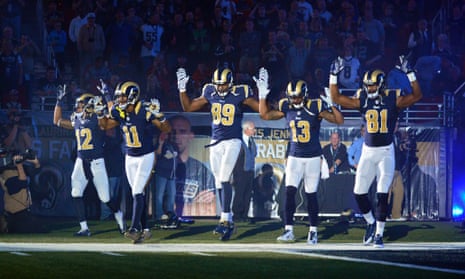 St Louis Rams players raise hands in apparent Ferguson gesture