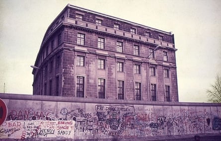 The Berlin Wall ran directly behind the Reichstag. The building in the photograph was one of the few East Berlin buildings allowed to remain next to the Wall. The windows had iron bars to keep people from jumping out to escape to the west
