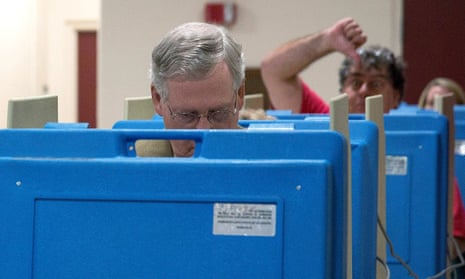  A voter gestures as Senate minority leader US Senator Mitch McConnell votes in Kentucky.