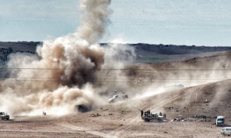 Smokes rises from the Syrian border town of Kobani as Isis militants continue their assault on Kurdish positions.