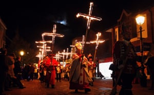 A costumed parade of burning crosses in Lewes