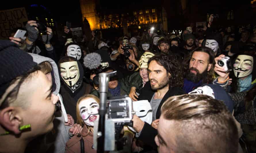 Russell Brand joins anti-capitalist protesters during the Million Masks March in London