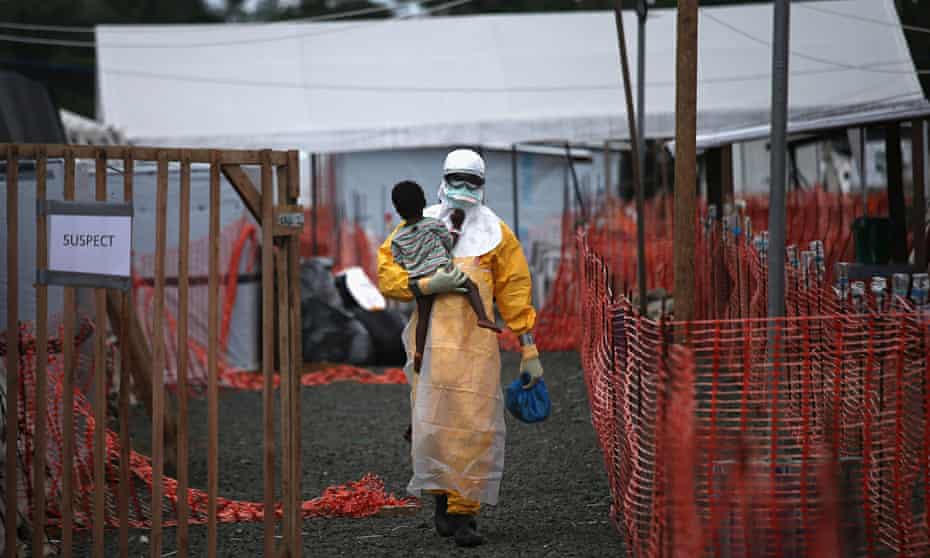 MSF doctor holding child suspected of having Ebola in Liberia
