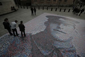 A digital mosaic of a photograph of British Army private James Ernest Beaney, killed in France in 1916 during the first world war. The portrait was created by artist Helen Marshall as people pay their respects to the fallen