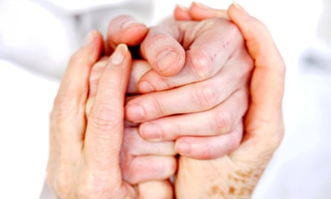 patient holding hands