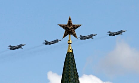 Russian military jets fly in formation above the Kremlin
