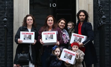 Comedian Russell Brand joins residents and supporters of the estate as they deliver their petition to 10 Downing Street.