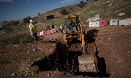 Technical staff start excavations in a park near Granada, where Federico Garcia Lorca is believed to be buried.