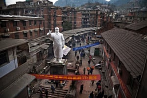 Huangshi, China. People mark the 115th anniversary of Mao's birth in front of a statue