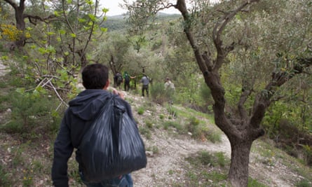 Militants walking on wooded hillside en route to the Syria-Turkey border in the Hatay province of Turkey.