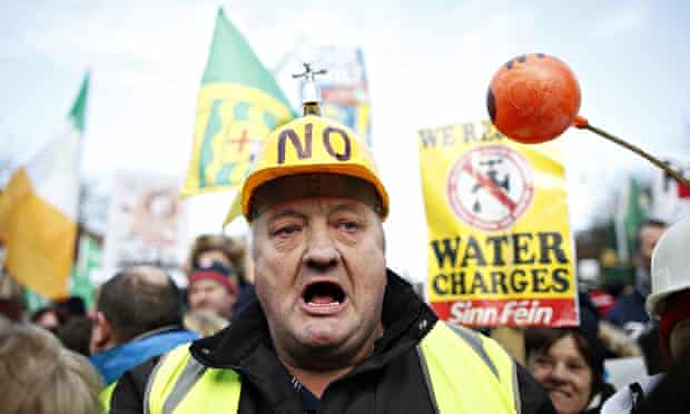 Water tax protesters gather in Dublin city centre. Despite concessions, the Fine Gael-Labour coaliti