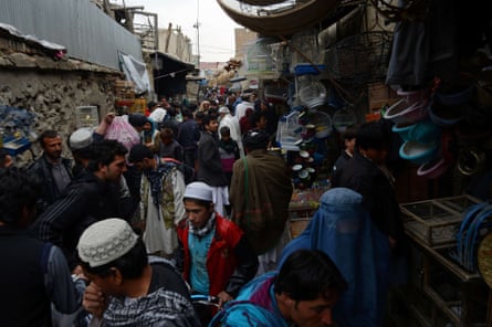 Afghan shoppers throng the Mandave market area in downtown Kabul.