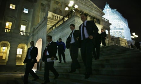Members of the House of Representatives leave after the vote on the $1.1tn omnibus spending bill.