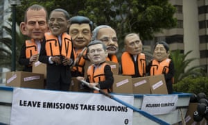 Activists on the sidelines of the UN climate talks in Lima, Peru, dress as world leaders and urge action on carbon emissions.
