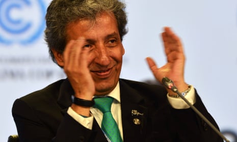 COP20 president and the Peruvian minister of environment, Manuel Pulgar, claps after approving the proposed compromise document.