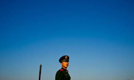 A Chinese soldier enjoys the ‘Apec blue’ sky after Beijing imposed drastic measures to reduce pollution levels for the recent summit.