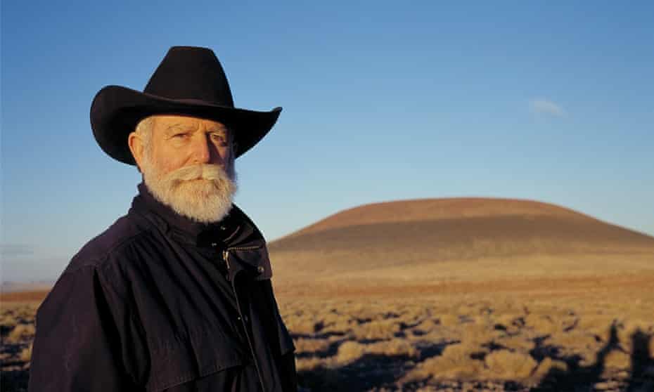 James Turrell in front of Roden Crater at sunset.