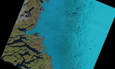 Supraglacial lakes on the Greenland ice sheet can be seen as dark blue specks in the centre and to the right of this satellite image. 