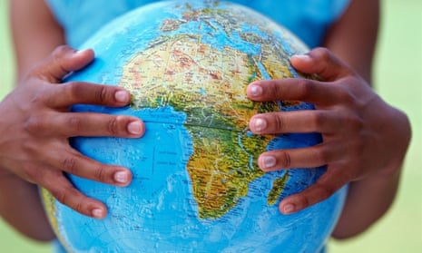 Close up of girl s hands holding globe