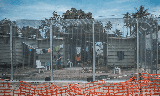 Asylum seekers in front of their housing units at the Manus Island Regional Processing Centre at Lombrum.
