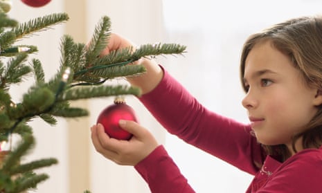Girl decorating Christmas tree