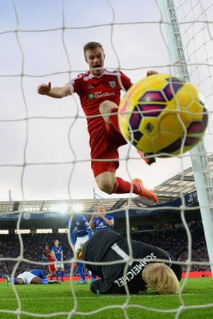 1 November: Chris Brunt of West Brom celebrates as he jumps over Kasper Schmeichel of Leicester City during their Premier League match at The King Power Stadium in Leicester, England.