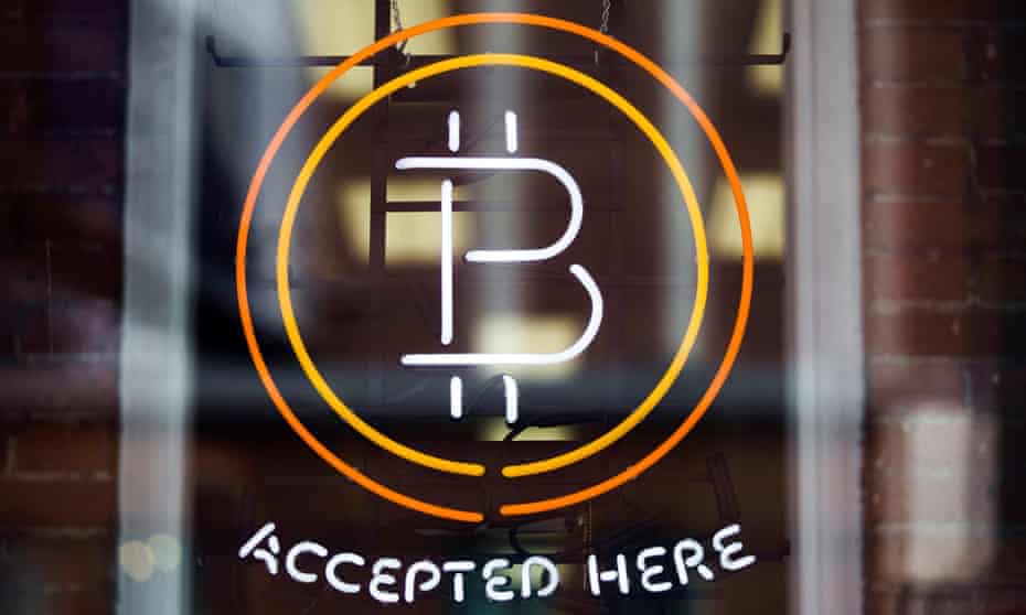 A Bitcoin sign is seen in a window in Toronto, in this file photo from May 8, 2014.