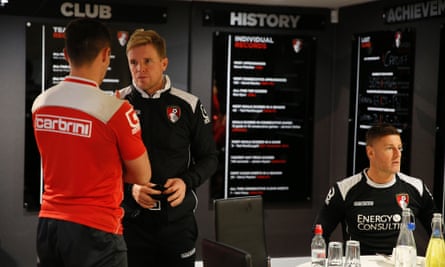 Howe talks to goalkeeper Darryl Flahaven in the players' room at the Goldsands.