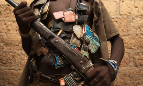 A member of the anti-balaka militia poses for a photograph on the outskirts of the capital, Bangui, in January