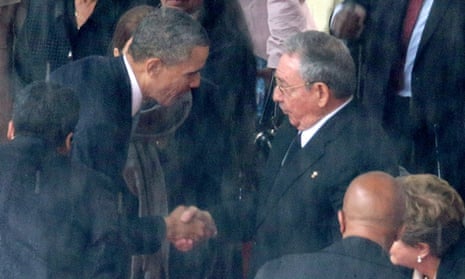 Barack Obama shakes hands with Cuban president Raul Castro during Nelson Mandela's memorial service in December 2013.