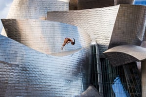 20 September: Orlando Duque of Colombia dives from the 27m platform on La Salves Bridge next to the Guggenheim Museum during the Red Bull Cliff Diving World Series in Bilbao, Spain.