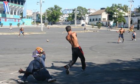 Cuban youths play baseball outside the Estadio Latinoamericano. The sport runs deep in Cuba, one reason why MLB would love to re-establish business relations with the island nation