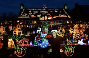 Eric Marshall, 75, from Bagby, North Yorkshire proudly shows off the mass of Christmas lights which adorn his home. Mr Marshall has built up his collection over the past 16 years, which now attracts coaches parties and many visitors who can contribute to the local church through the donation boxes he leaves outside
