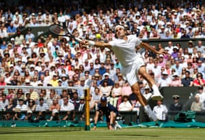 6 July: Roger Federer of Switzerland watches the ball flash past his outstretched racket during his men’s singles final tennis match against Novak Djokovic at Wimbledon