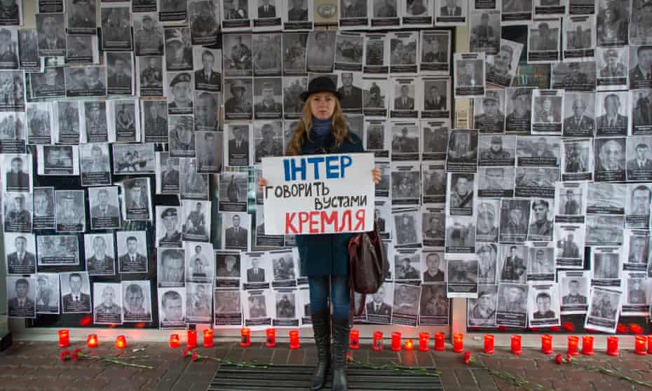 A Ukrainian activist protests against a Russian propaganda TV series.