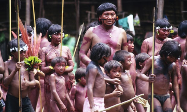Davi Kopenawa, Yanomami leader and shaman surrounded by children, Demini, Brazil.
