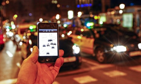 The Uber app is seen on a smartphone 