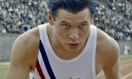 Jack O'Connell as Louis Zamperini on an athletics track in Unbroken